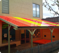Coloured corner canopy and play surfacing, St Mark's