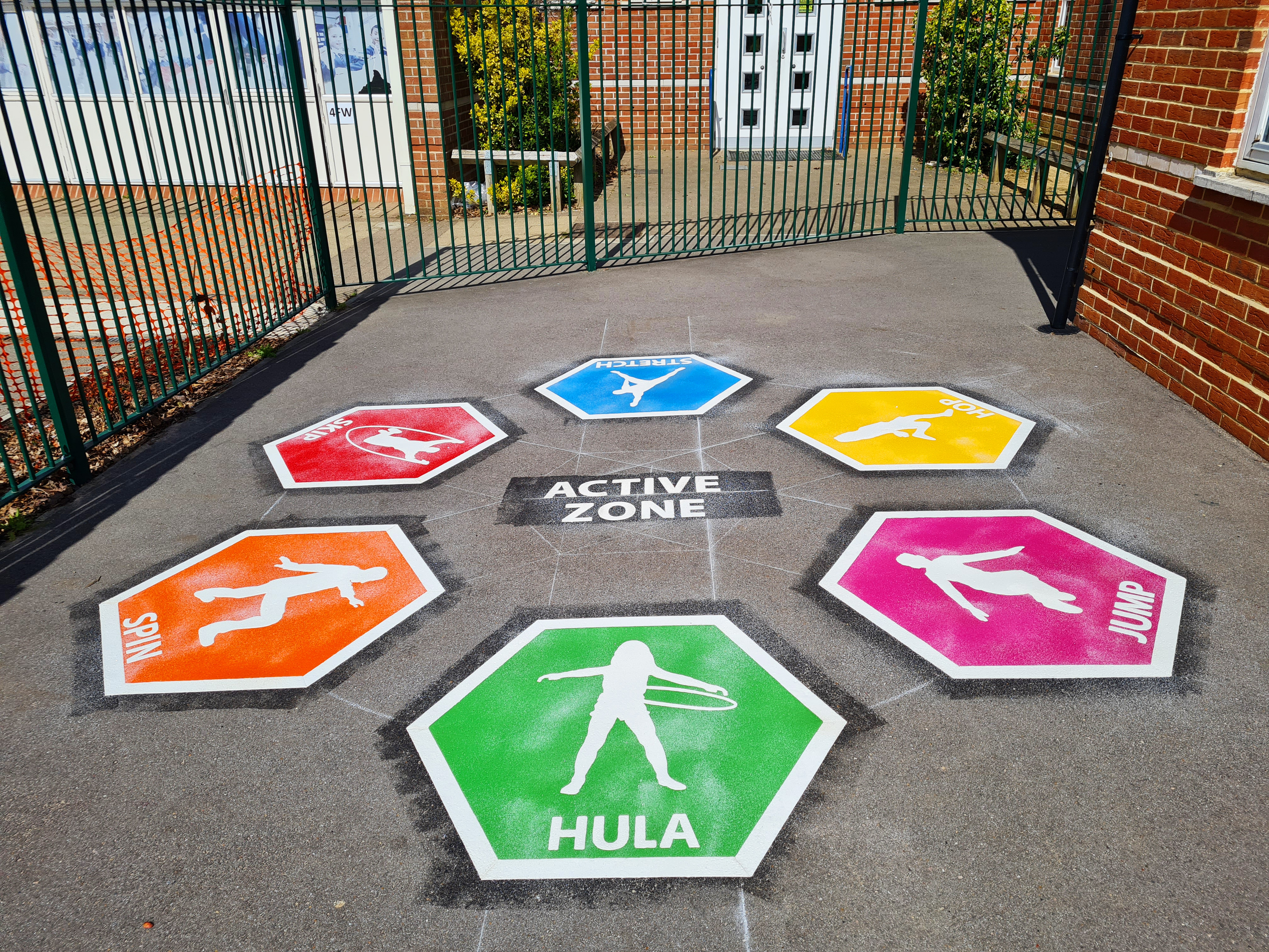 Colourful thermoplastic playground markings installed by Commercial Play